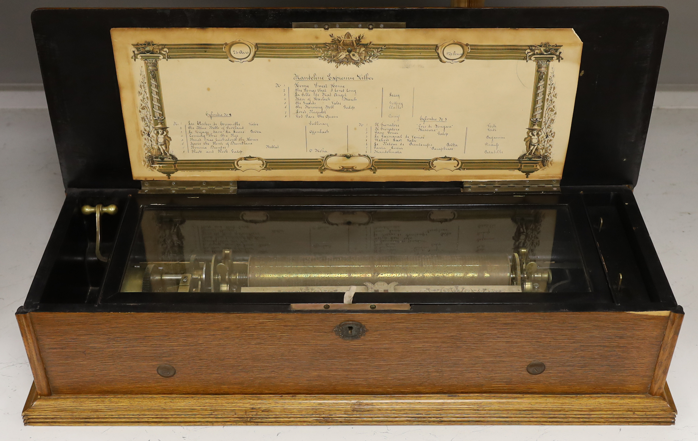 A late 19th century Swiss musical box with 92 tooth comb (one tooth broken and missing), with eight tune 13 inch cylinder and two additional cylinders, the case re-veneered in oak, 79cm wide